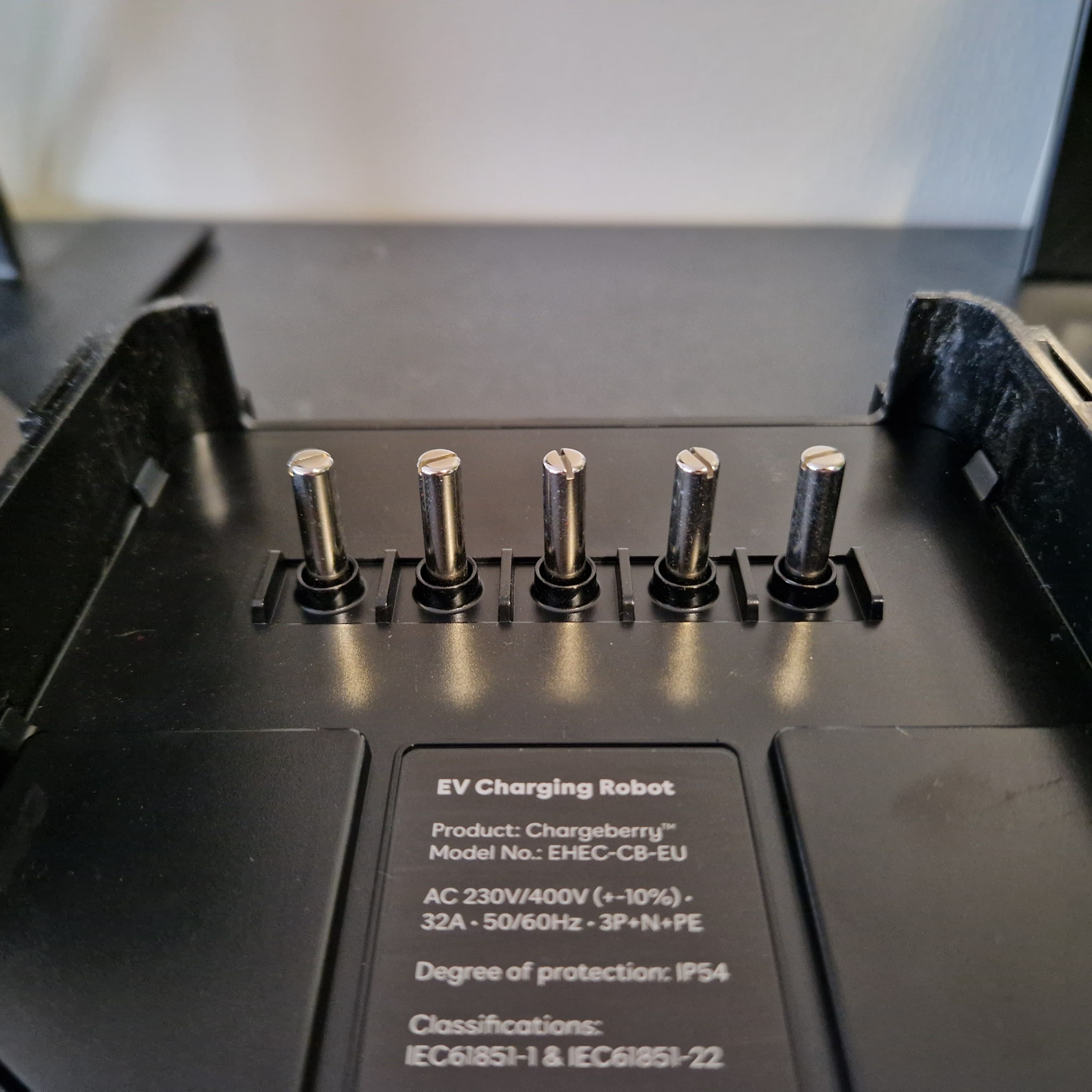 The chargeberry pins, from the bottom of the charger